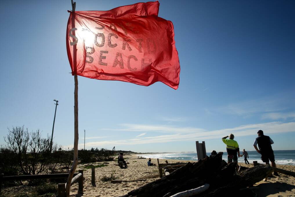 DESPERATE PLEA: Residents call for action on offshore sand nourishment plan to save Stockton beach, as City of Newcastle and the NSW government in stand-off over the project. Picture: Jonathan Carroll