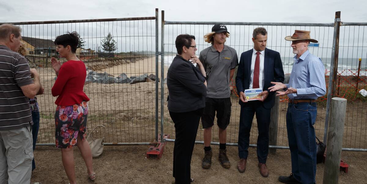 Newcastle MP Tim Crakanthorp, second from right, with shadow environment minister Penny Sharpe, wearing black, and concerned residents at Stockton beach.
