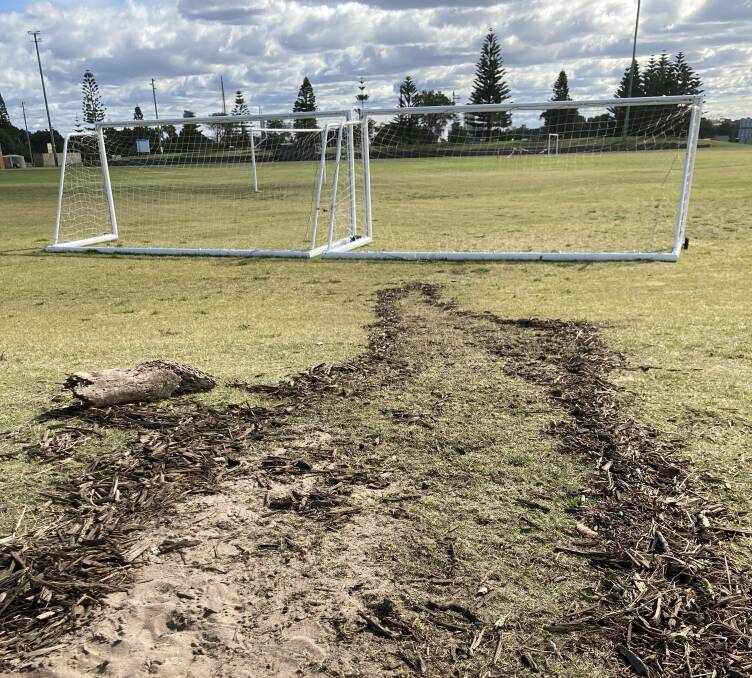 UNDER THREAT: Big swell has topped what is left of the sand dunes and reached the sports complex at Corroba Oval, Stockton, home to the suburb's soccer and Little Athletics clubs.