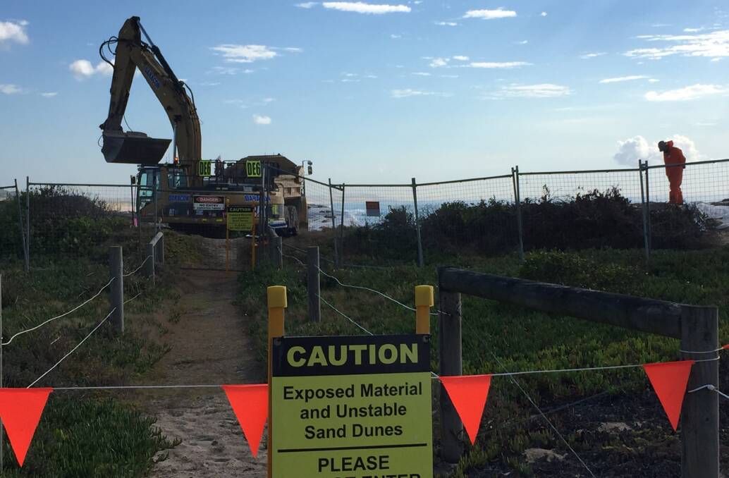 EROSION WOES: Hunter Water has started temporary works to stop rubbish from an old Newcastle City Council tip spewing garbage into the ocean at Stockton. Picture: Donna Page