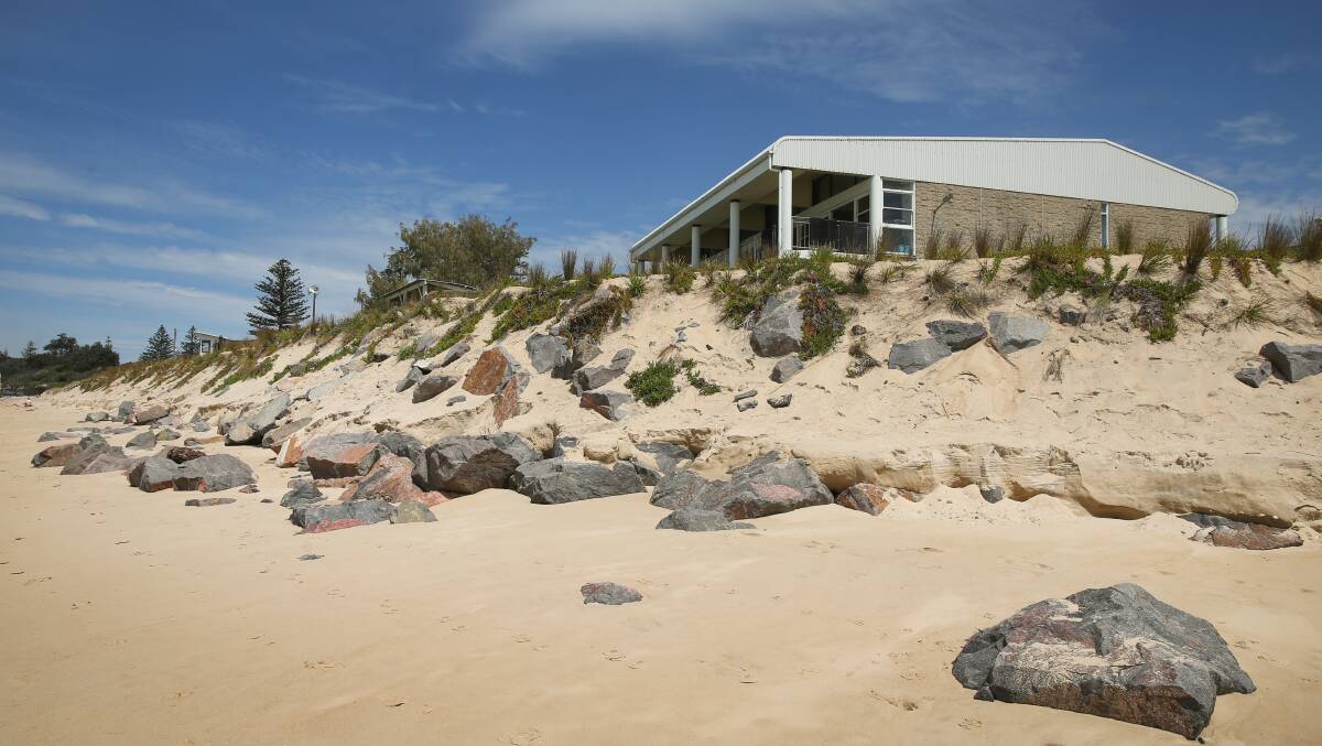 UNDER THREAT: Newcastle City Council's $3 million rockwall that was built to save Stockton Surf Life Saving Club from erosion.