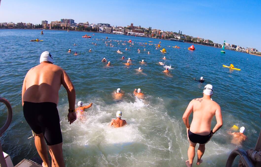 DIVE IN: Early bird entries are open until January 24 for the 700m social swim and 1400m competitive swim across Newcastle harbour. Picture: Daniel Danuser