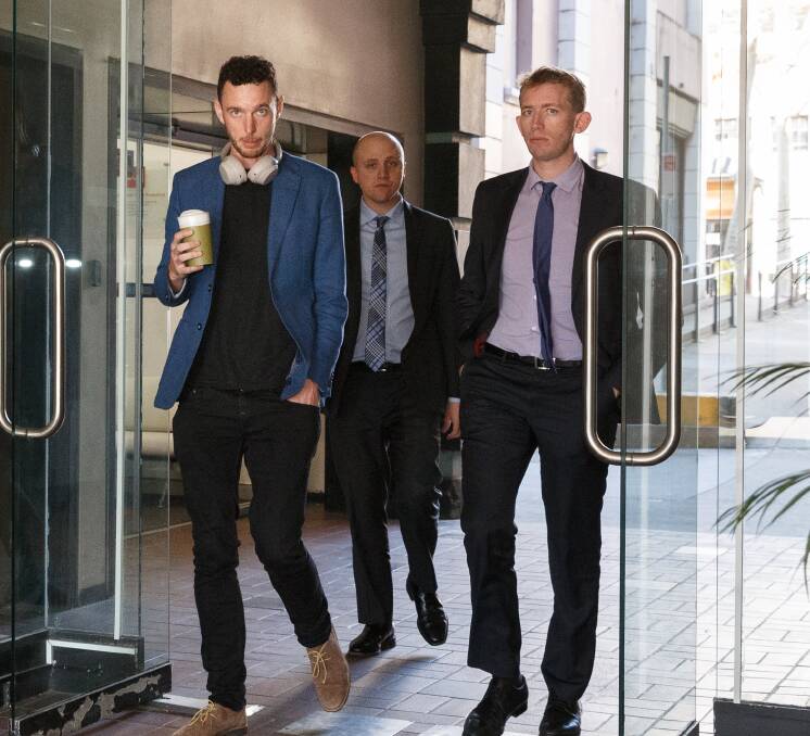 Daniel Roberts, left, outside the NSW Civil and Administrative Tribunal with his solicitor Jared Resevsky, of McDonald Johnson Lawyers, and barrister Patrick Williams, right, of Newcastle Chambers. Photo: Max Mason-Hubers