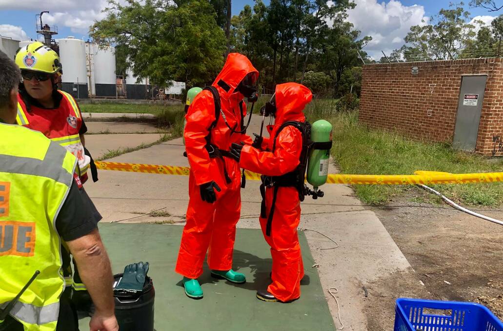 DANGER: Hazardous materials officers prepare to enter the Kyle Street, Rutherford, site following a break-in. Pictures: Fire and Rescue NSW 