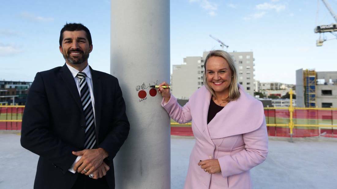 TICKLED PINK: City of Newcastle chief executive Jeremy Bath and lord mayor Nuatali Nelmes during construction of the council's new headquarters at Stewart Avenue, Newcastle West, in June 2018.