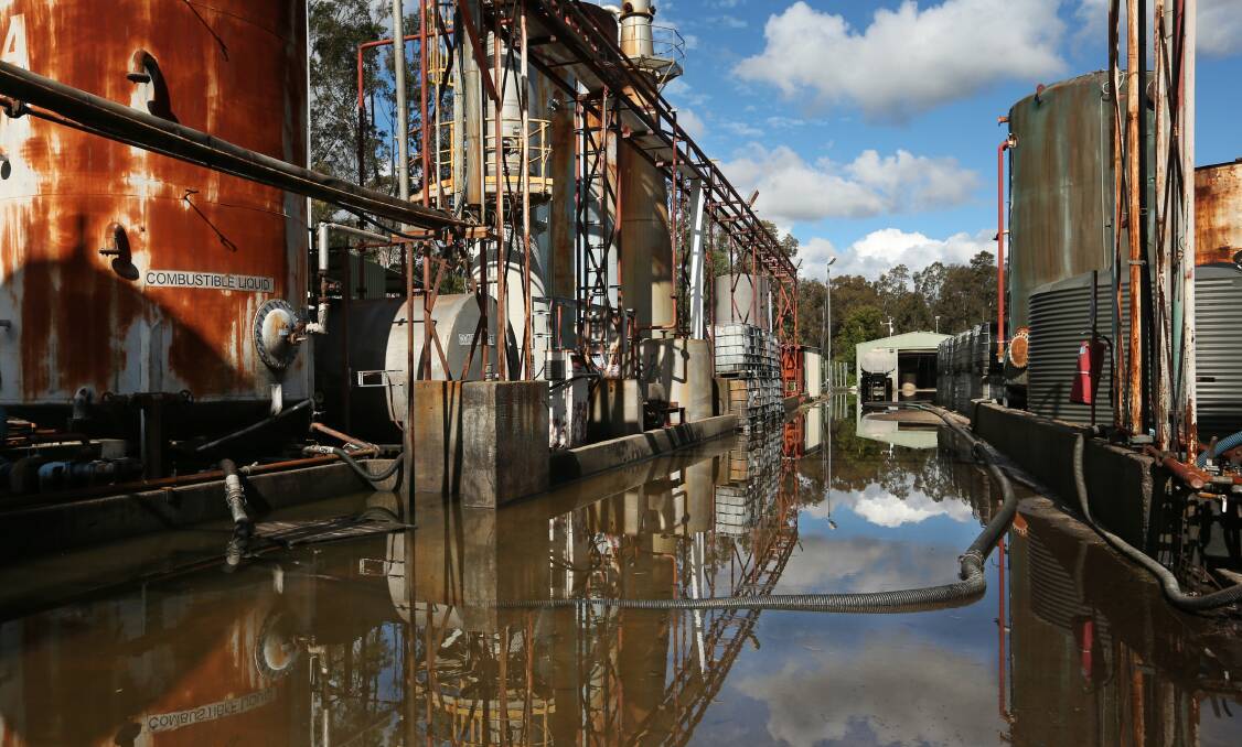 FLOODING: The former Truegain waste oil refinery at Maitland following heavy rain in July last year. The site has previously overflowed polluting surrounding waterways. Picture: Simone De Peak
