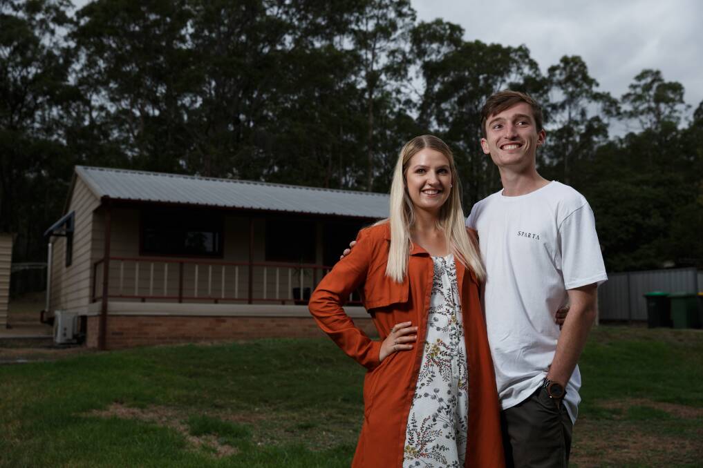 WINNERS ARE GRINNERS: First-home buyers Jadon Bradley and Chloe Brown exchanged contracts on a house at Pelton, near Cessnock, this month. Picture: Marina Neil