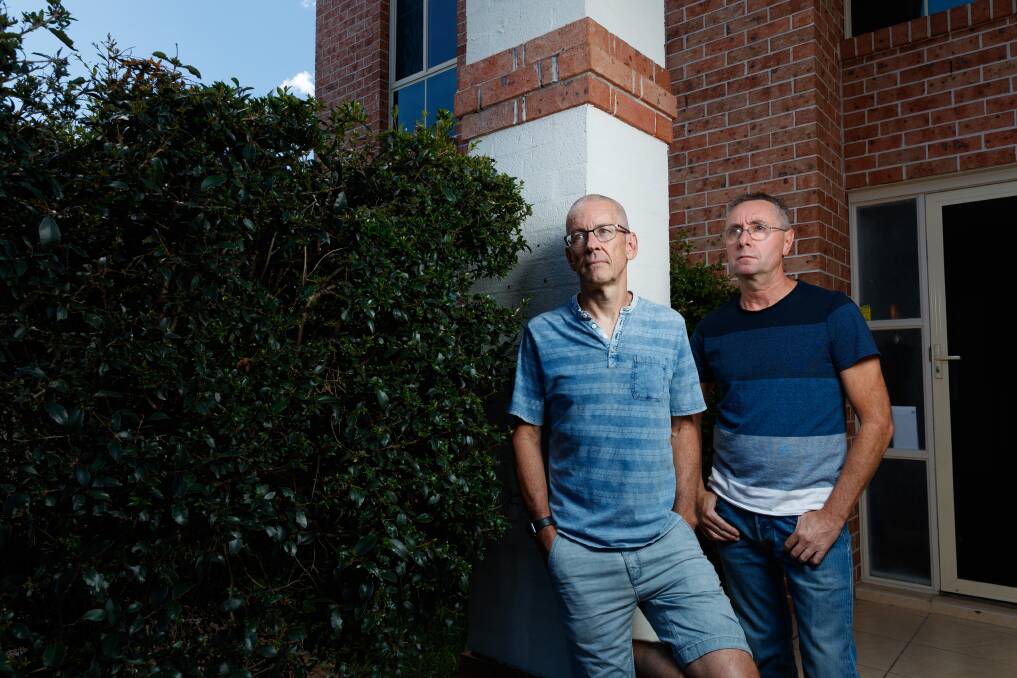 Homebuyers Greig Sheridan and his partner Glen outside the Adamstown home they purchased using Henderson Advocacy. Picture by Max Mason-Hubers