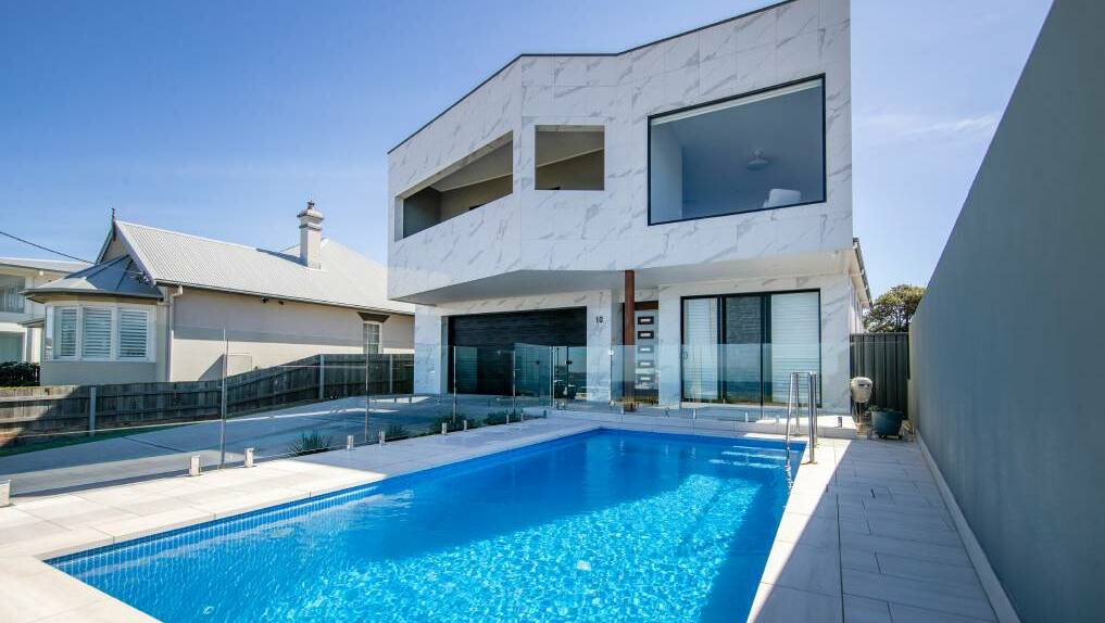TROPHY HOME: Mr Siderovski's wife, Valentina, purchased this seven-bedroom, six-bathroom house in Merewether for $6.15 million in September last year.