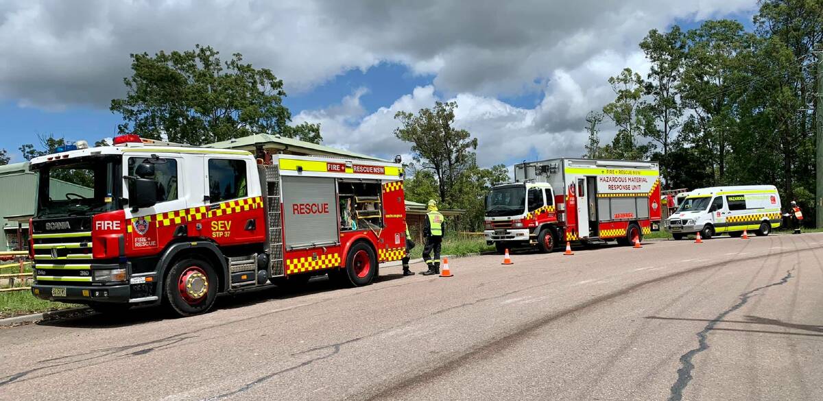INVESTIGATION: Fire and Rescue NSW crews at the abandoned Truegain waste-oil refinery site on Friday after intruders broke into the former laboratory.