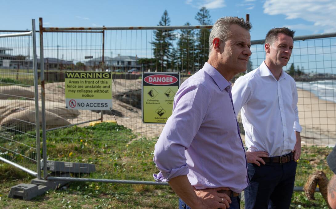 Newcastle MP Tim Crakanthorp and NSW Labor leader Chris Minns at Stockton beach in October. NSW Labor has pledged $21 million for mass sand nourishment to restore the beach if it wins the upcoming election. Picture: Marina Neil