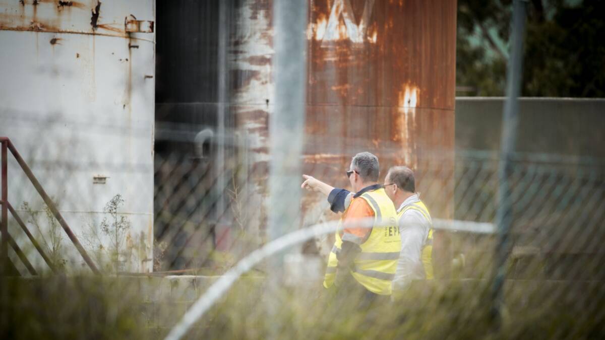 THREAT: Environment Protection Authority officers doing a walkover of the former Truegain waste-oil refinery plant at Rutherford after reports of a potential spill in 2017. Picture: Perry Duffin