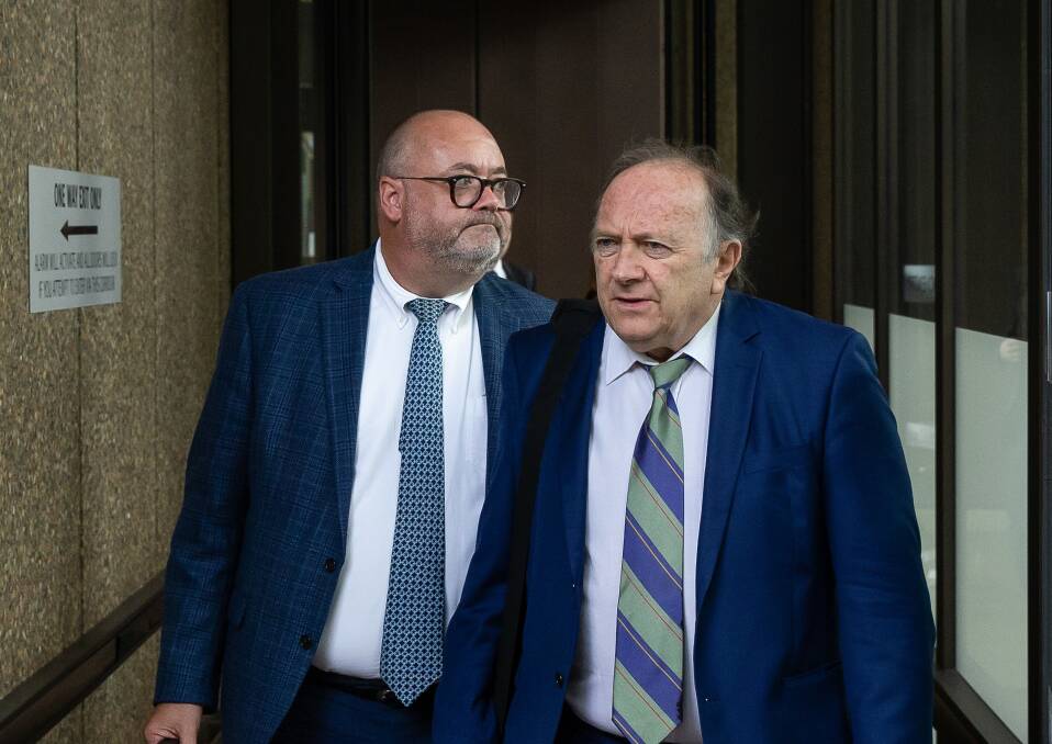 CONTROL: Harvest Homes former general manager Adam Hinchliffe, a convicted fraud, left, leaving the Sydney Federal Court with his solicitor Derek Ziman on Wednesday. Picture: Marina Neil