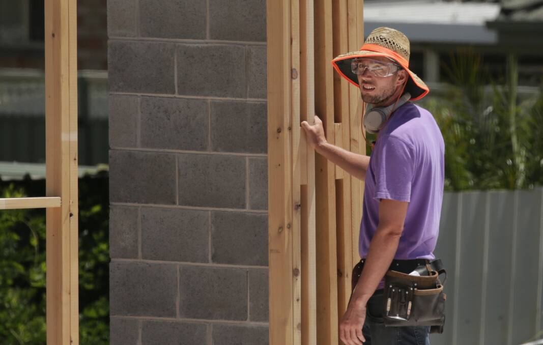 DODGY: Daniel Roberts, who is not a licensed builder but is a member of the Royal Institution of Chartered Surveyors, on the tools at his Abel Street, Wallsend development site where 20 units are under construction. Picture: Simone De Peak