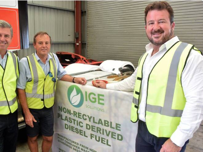 AMBITIOUS: Former executive director of Integrated Green Energy Solutions Paul Dickson in Taree, right, speaking with Jim Pearson Transport boss Jim Pearson about the possibility of using diesel from planned plastic-to-fuel plants in 2000.