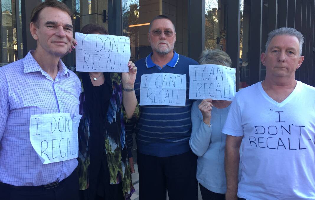 DEVASTATED: Ray Walker's victims and supporters staged a silent protest at Sydney's Federal Court this week during a bankruptcy investigation. 