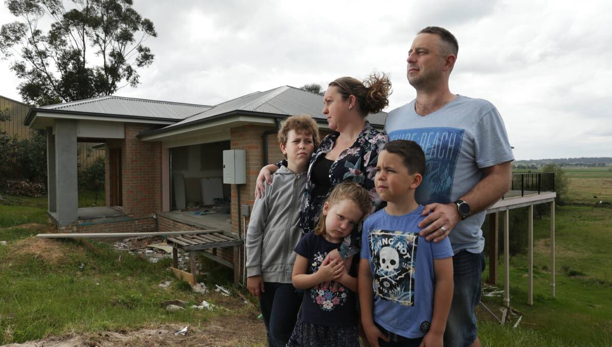 FAMILY: Phillip Kapeller and Rachael Cesnik with their children at their Gillieston Heights home in 2019. 