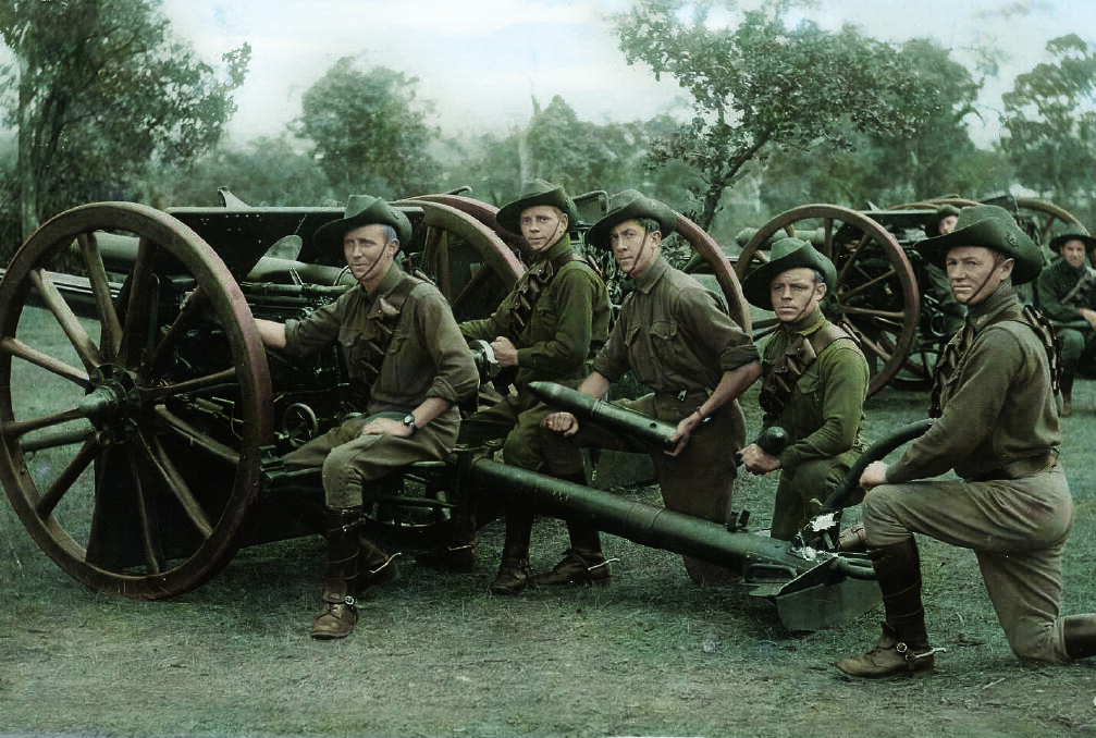 BARRAGE: Australian members of a field artillery battery pose with their 18 pounder gun. Photo: The Digger's View. WW1 in Colour by Juan Mahony