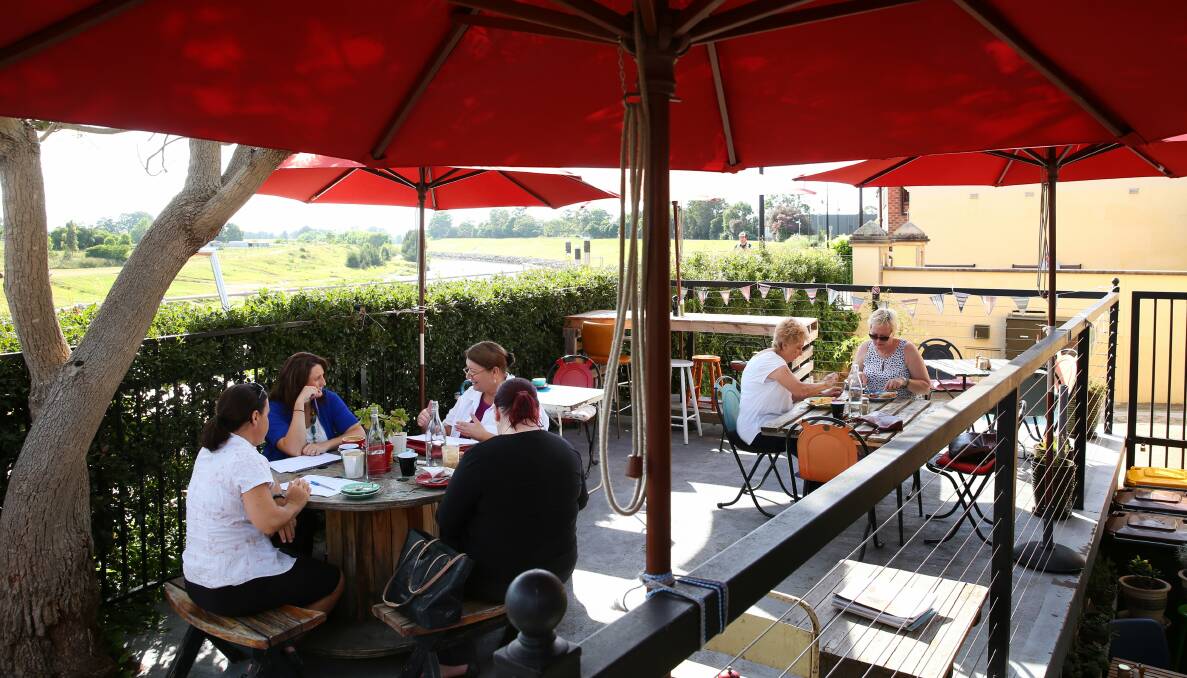 RIVERSIDE: Favourite Chair Cafe has a large shady deck from which to enjoy Hunter River views. Pictures: Max Mason-Hubers