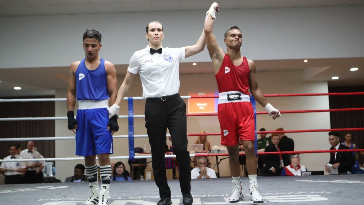 QUALIFIED: Alex Winwood (right) punched his ticket to the Olympics at the last minute as he powered to victory against an Iranian opponent in the final round of a box-off. Photo: Supplied.