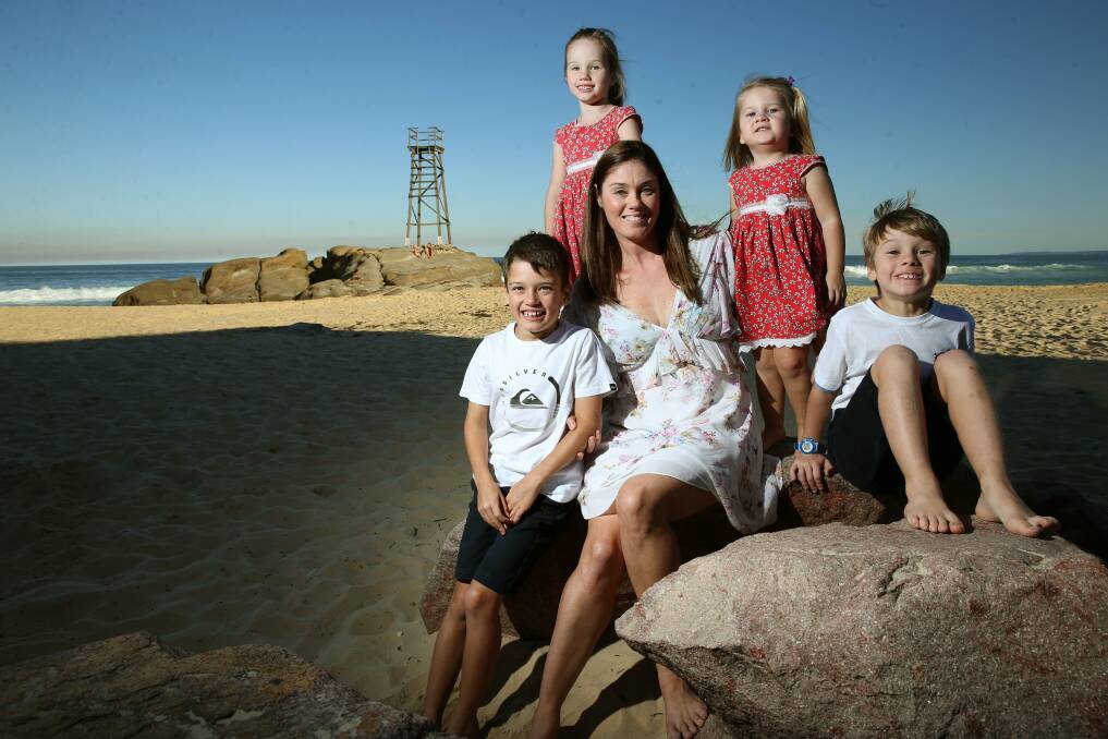 Family first: Holland Healthcare founder Jennifer Holland at Redhead beach in 2016 with her four children. Picture: Marina Neil. 
