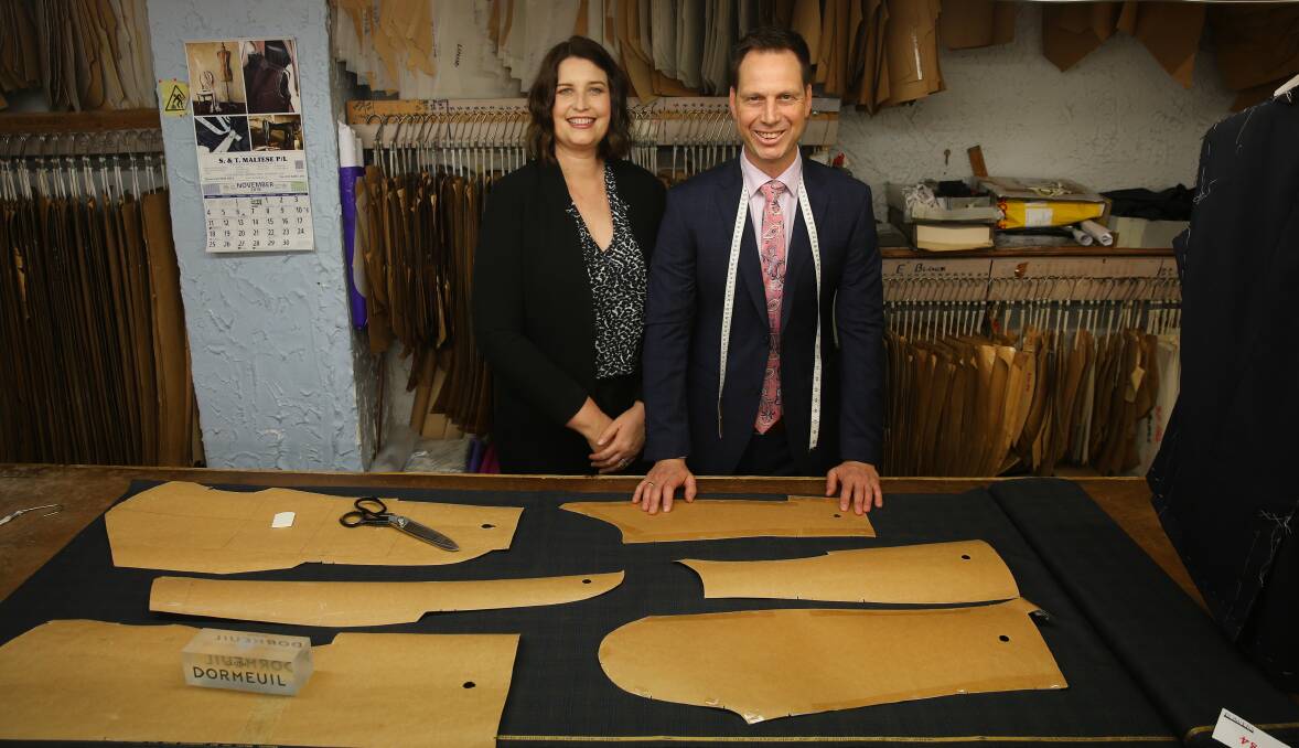 Tailor made: Bronwyn and Andrew Rundle, the second generation of family to run the famous suit-making business. Picture: Marina Neil