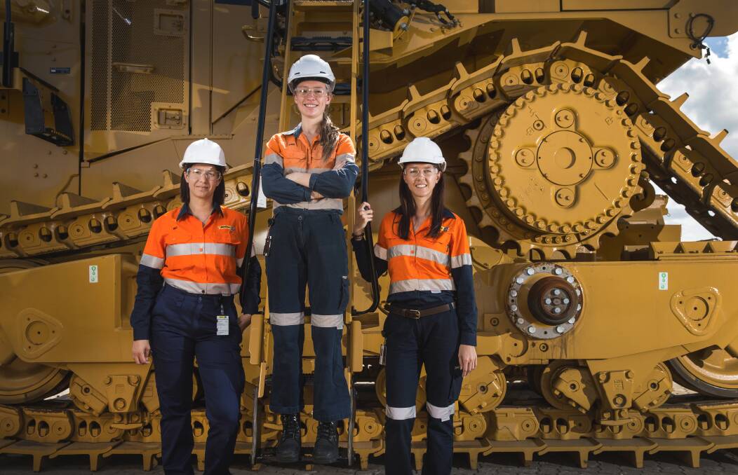 Women at work: Rebecca Caldwell, left, Alex Mattson and Amy McTiernan at WesTrac's Tomago plant. Picture: Marina Neil