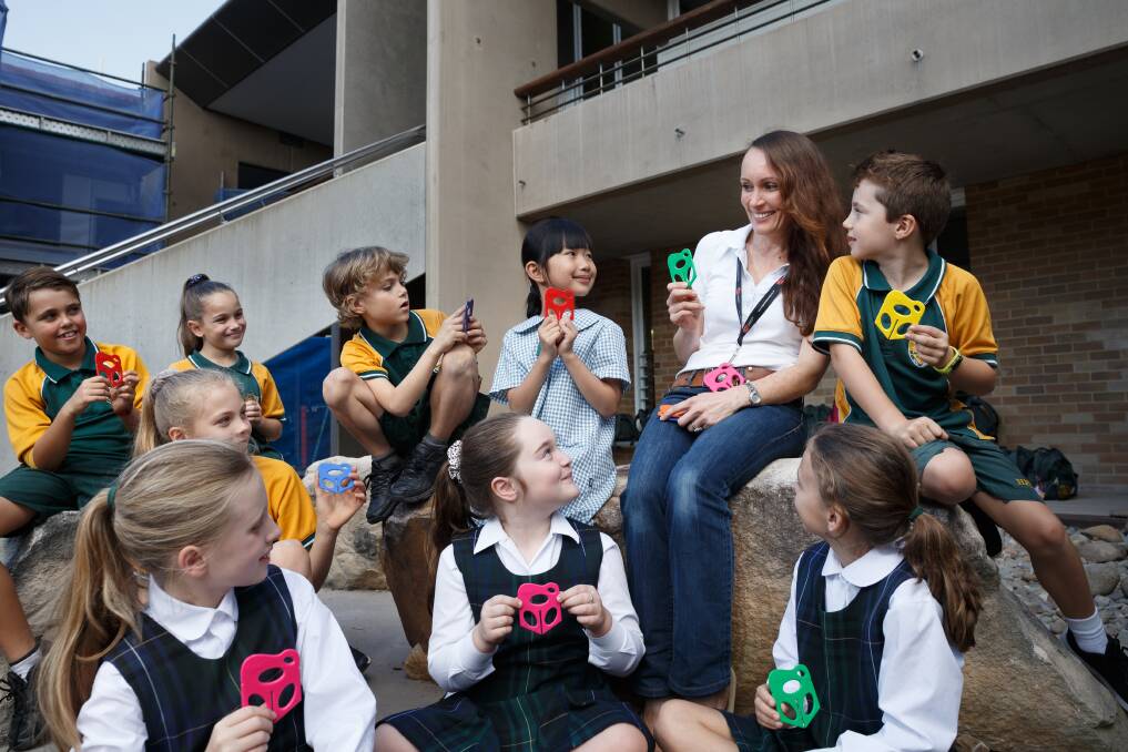 Classroom act: Primary school teacher Kylie Burrett and Holy Family Primary School students with the Splat. Picture: Max Mason-Hubers 