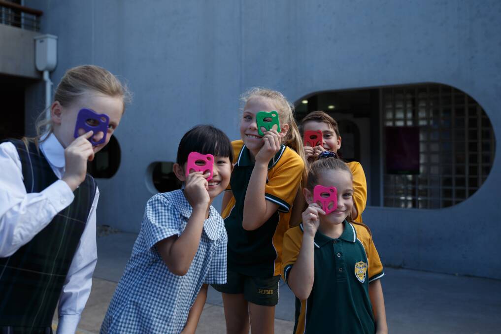 Bright idea: Students Chelsea, Hien, Ava, Oliver and Sloane with the Splat at Holy Family Primary School in Merewether. Picture: Max Mason-Hubers 