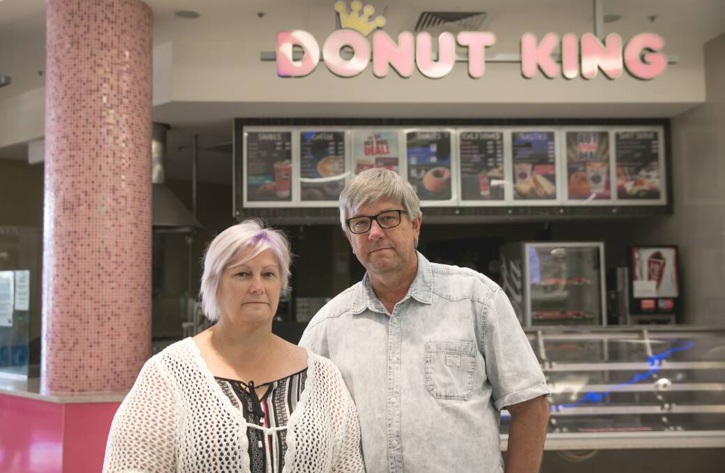Closed: "No one goes into business to fail," says Deborah Longhurst, with husband Russell, at their former Donut King franchise. Picture: Marina Neil 