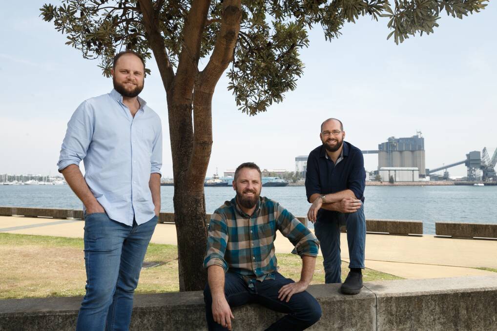 New horizons: Nick Smith, left, Ashley Cox, and Aaron Hoye are taking Newcastle-based Corridor.AI to global markets. Picture: Max Mason-Hubers 