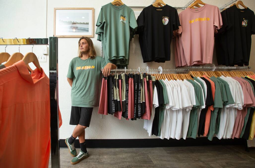 Casual cool: Lone Clothing Co founder Mitch Samways in his Bar Beach store. Samways debut store remains in Redhead. Picture: Marina Neil. 