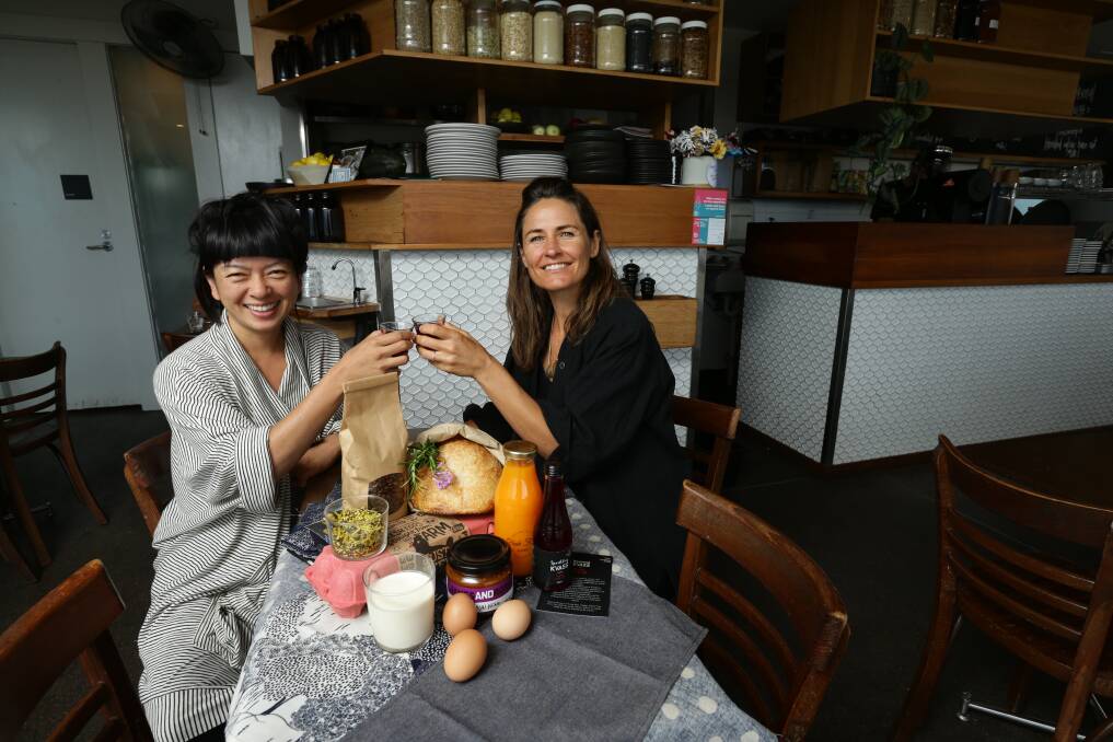 Breakfast of champions: Estabar's Bec Bowie, right, and High Tea With Mrs Woo's Rowena Foong with a sample of the immunity-building DIY breakfast. Picture: Jonathan Carroll 