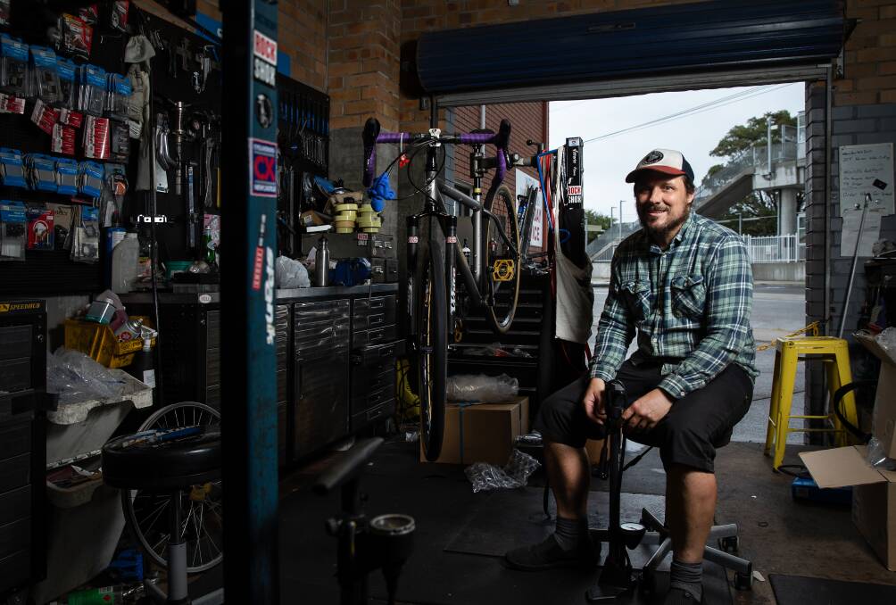High demand: John Maisey, owner of Ghost Gum Bikes, which has witnessed a surge in bike repair jobs. Picture: Marina Neil. 