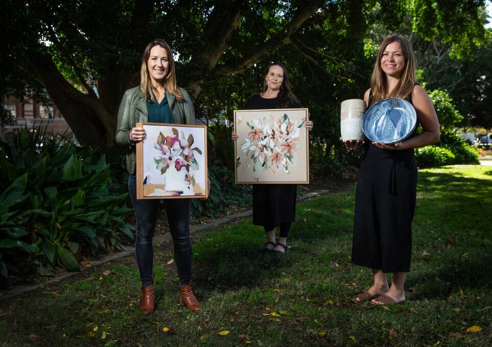 New format: Olive Tree Markets founder Justine Gaudry, centre, with artist Prudence De Marchi, left, and ceramicist Jacquie Garcia. Due to Covid-19, this weekend's markets in Newcastle will be run in a virtual format. Picture: Marina Neil 
