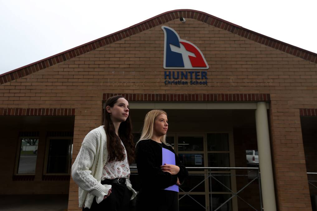 In training: Lily McGough, left, and Bronte McInnes, outside their employer Hunter Christian School at Mayfield. Picture: Simone De Peak 