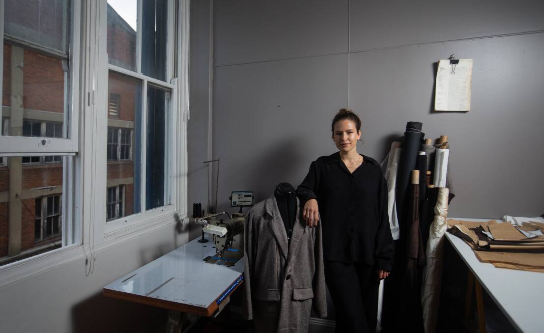 Small, sustainable steps: Novocastrian fashion designer and Saint founder Laura Howard in her Wickham studio. Picture: Marina Neil