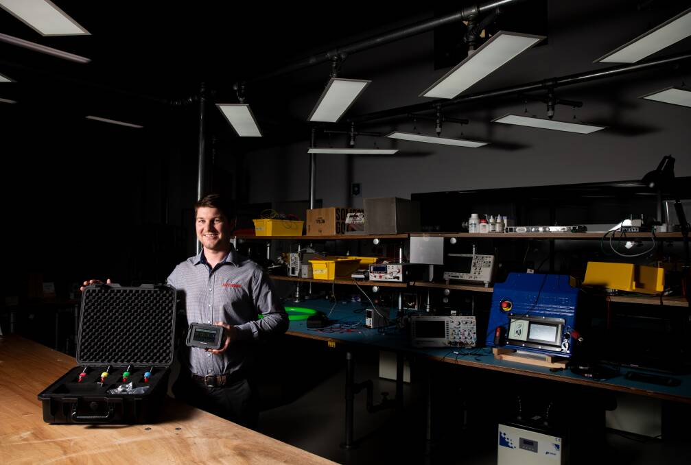 Bright idea: Luke Dawson with the Safe-Gauge, which he developed with help from The Melt industrial lab in Warners Bay. Picture: Marina Neil 