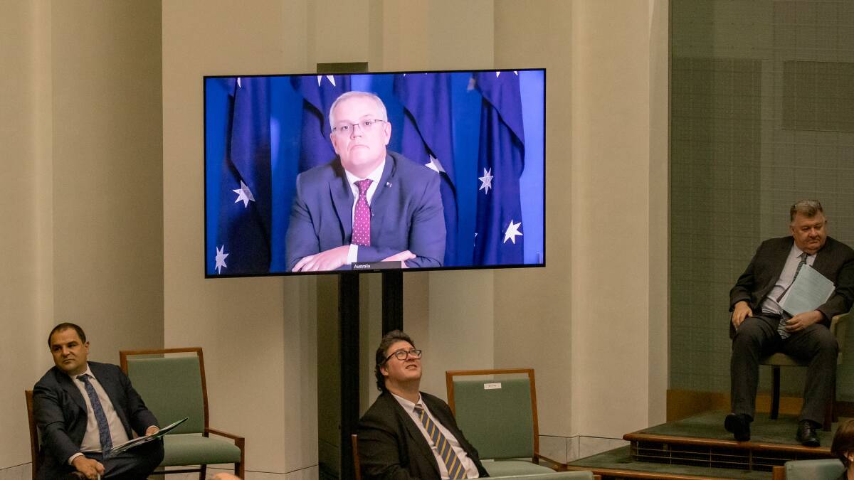 Member for Dawson George Christensen listens to Prime Minister Scott Morrison join question time remotely frrom the Lodge on Wednesday, where he is quarantining for 14 days following a working trrip to Japan. Picture: Sitthixay Ditthavong -THE CANBERRA TIMES, ACM.