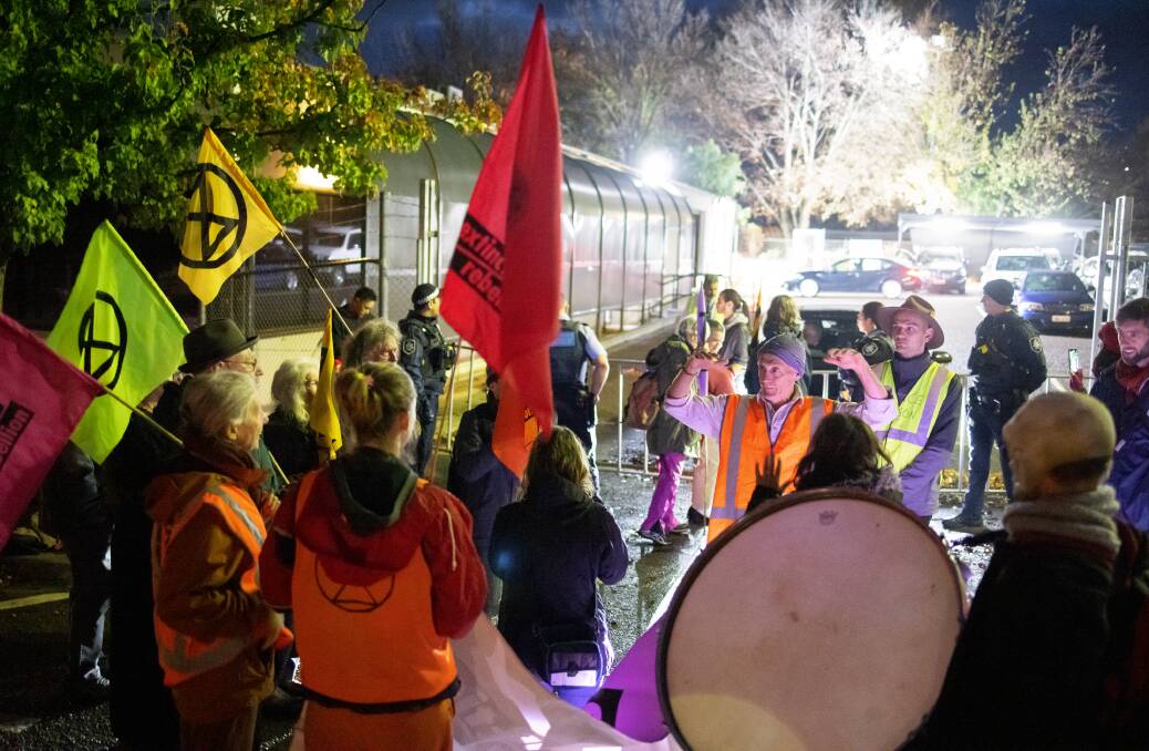Extinction Rebellion protestors block access to government cars ahead of the budget announcement on Tuesday. Picture: Alex Crowe