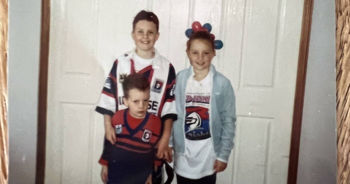 Knights hooker Olivia Higgins (right) with her two brothers - Liam and Luke - ahead of the 2001 grand final. Picture supplied