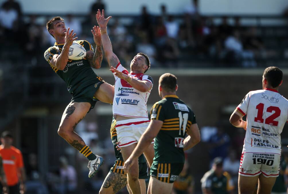 UP IN THE AIR: Macquarie and Souths playing at Townson Oval earlier this Newcastle Rugby League season. Picture: Marina Neil