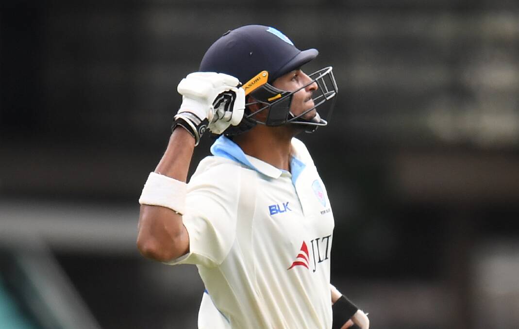 MILESTONE: NSW batsman Jason Sangha celebrates after reaching three figures for the first time in a Sheffield Shield match. Picture: AAP