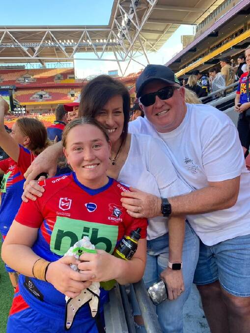 Knights lock Kayla Romaniuk with her parents after last weekend's NRLW semi-final. Picture supplied