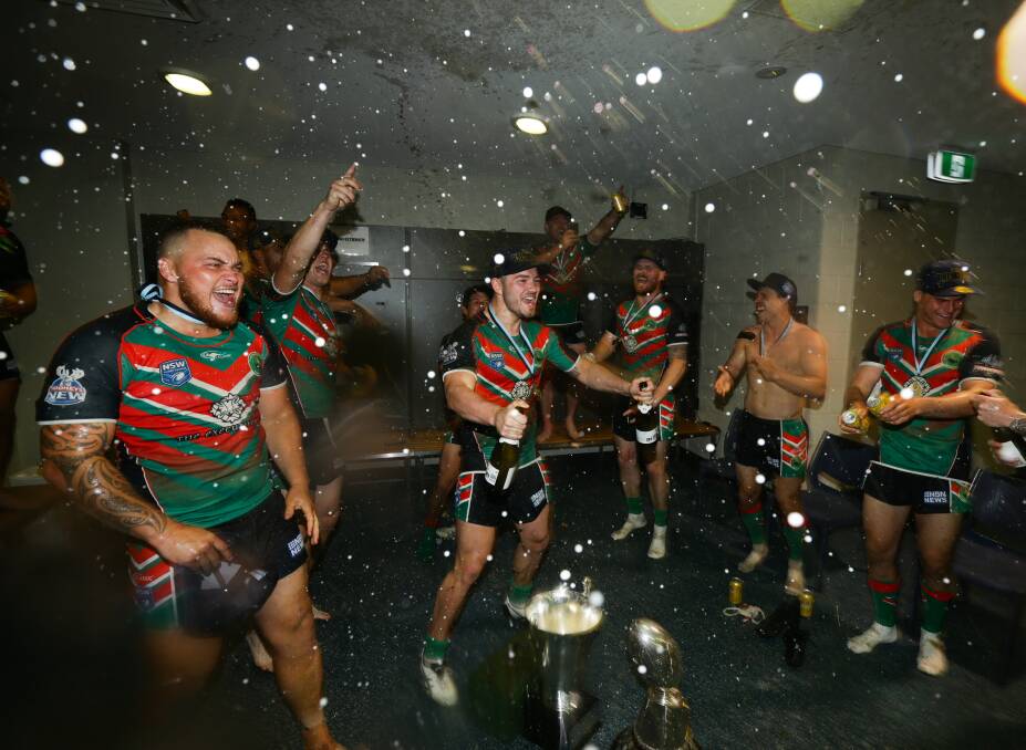 CELEBRATIONS: The drinks were flowing for Western Suburbs in the dressing sheds at McDonald Jones Stadium after completing a premiership double on the weekend. Picture: Jonathan Carroll