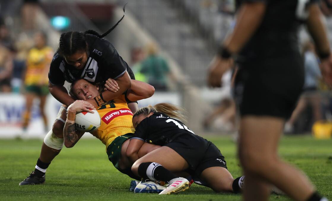 CAN'T HOLD ME DOWN: Holli Wheeler gets tackled representing Australia in October. Picture: Sylvia Liber