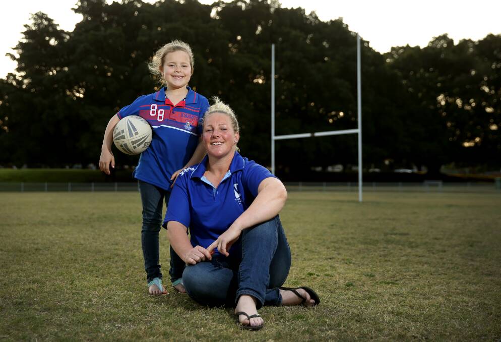 OPPORTUNITY: Sydney Roosters signing Bec Young with daughter Jarrah ahead of North Newcastle playing in the 2017 NSW Women's Premiership grand final. Picture: Marina Neil