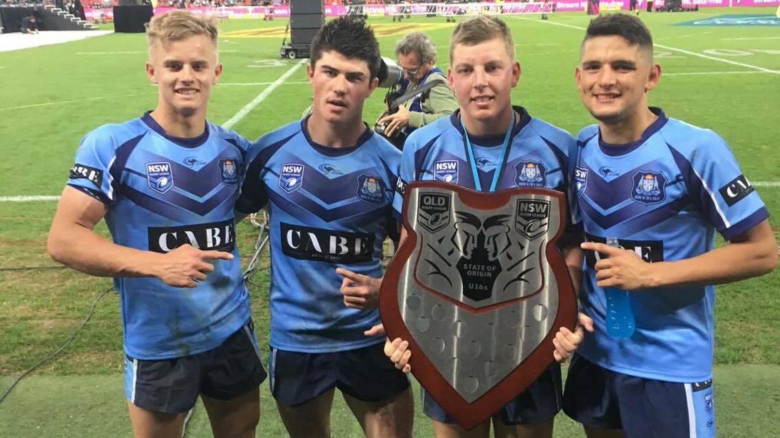 VICTORY: Knights quartet Cooper Jenkins, Bradman Best, Jaron Purcell and Harry Croker with the under-16 interstate shield after helping NSW defeat Queensland in Brisbane on Wednesday night. Picture: Twitter via @NRLKnights