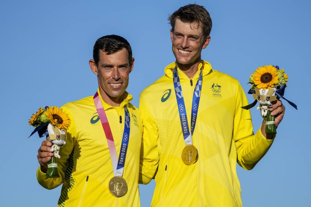 MOMENT IN THE SUN: Mat Belcher and Will Ryan received Olympic gold medals in Tokyo on Wednesday. Picture: AP Photo/Gregorio Borgia