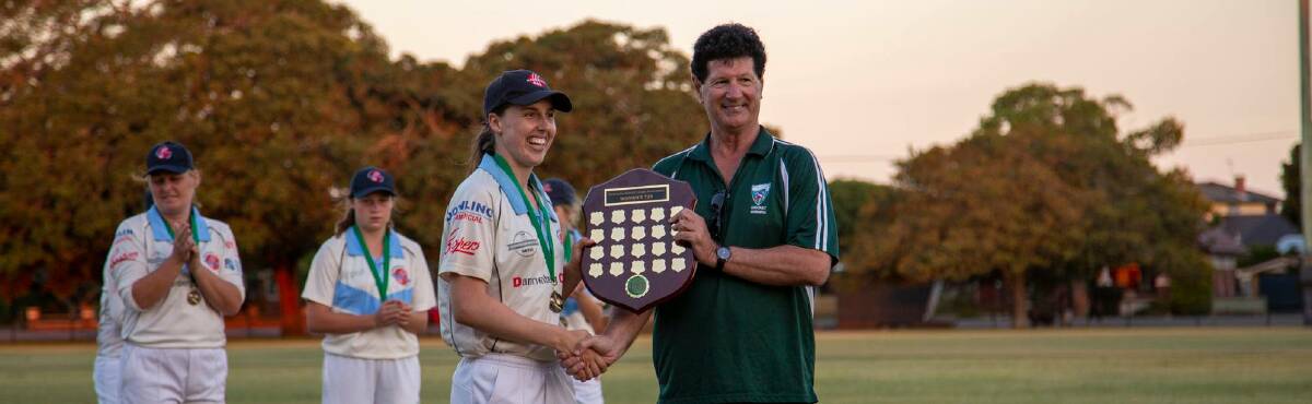 NEXT CHALLENGE: City captain Kirsten Smith with NDCA chairman Paul Marjoribanks after the inaugural Newcastle women's T20 league final in November. Picture: Facebook via Newcastle City Cricket Club 